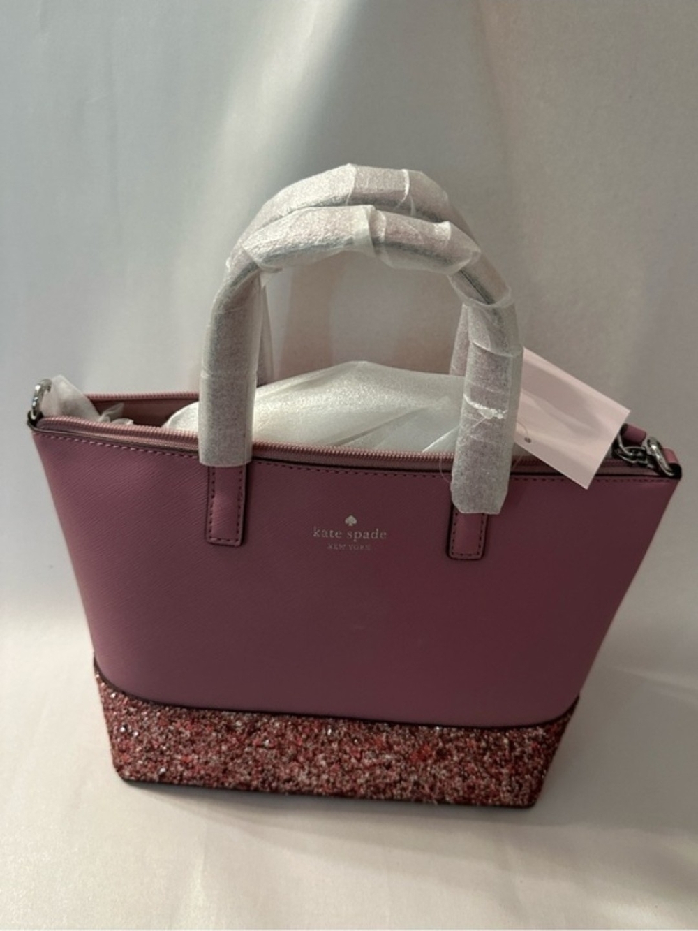 kate spade pink satchel with glitter bottom